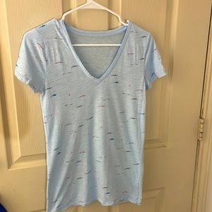 This is an XS blue J. Crew top that pairs great with fun shorts.